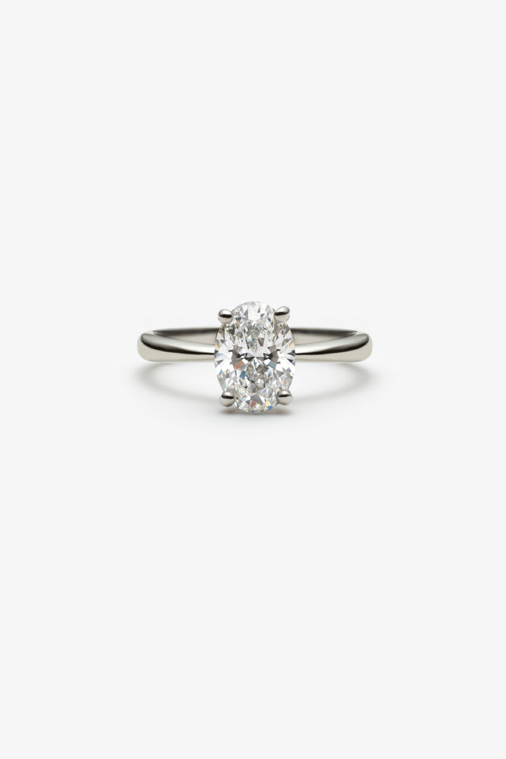 Bague Martini solitaire diamant ovale 1.50ct 18k blanc/pt950